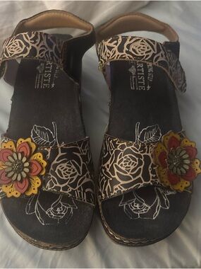 L’Artiste Black Floral Leather Sandals with Red and Yellow Flower Accents